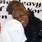 Mike Tyson hugs Evander Holyfield