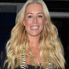  Denise van in thigh-skimming leather skirt